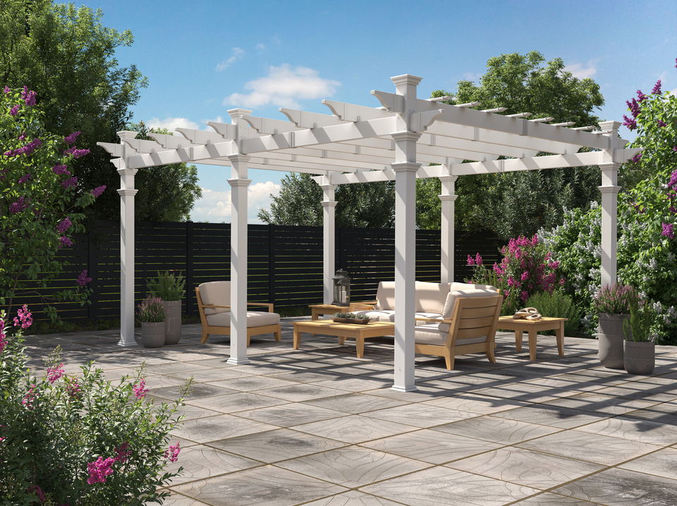 White pergola on a wooden deck with a seating area underneath