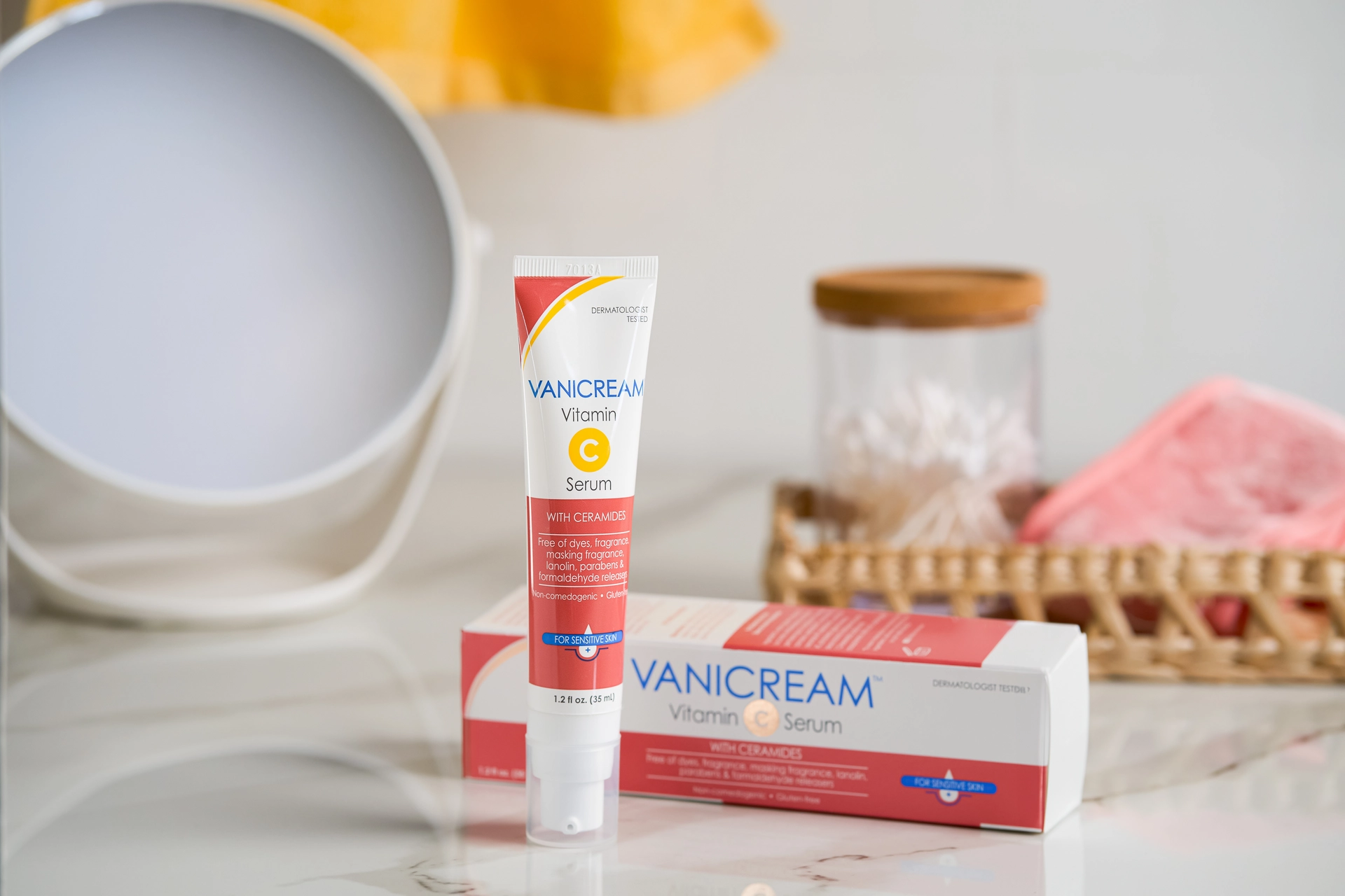A tube and a carton of Vanicream Vitamin C serum lay on a counter.