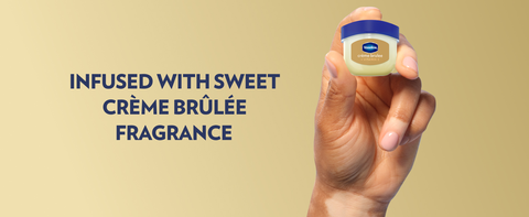 Hand holding a small pot of Vaseline Lip Therapy Jelly &amp; text about Crème Brûlée fragrance infusion.