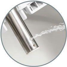 Close up shot of the bidet seat nozzle spraying water