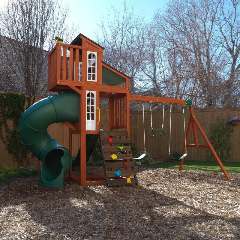 Front view of Austin Playset with tube slide, rockwall, and swings