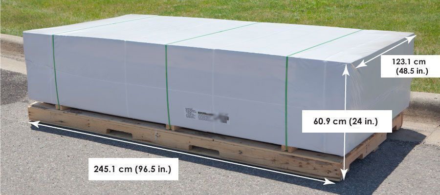 shed kits on curbside protected in shrink-wrap