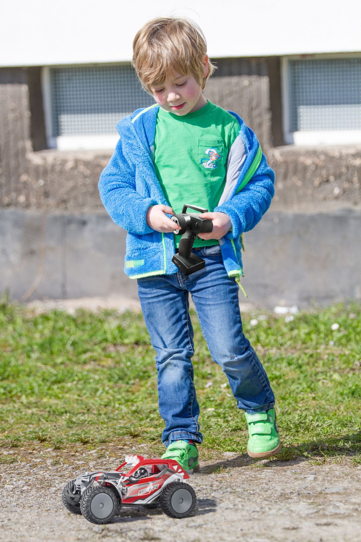 Boy playing Shift 24 red outside