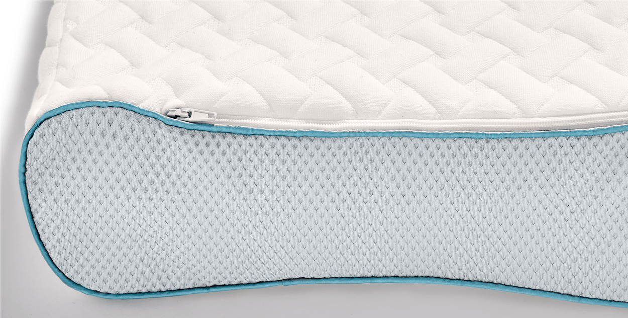Image:  Contour pillow on white background, closeup on cover's zipper and mesh panels.